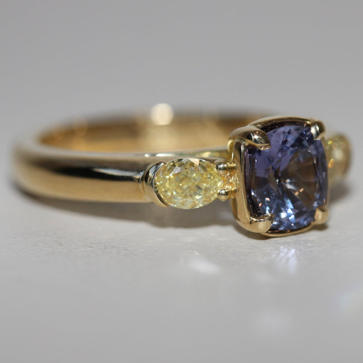 1.46CT VIOLET SPINEL & FANCY YELLOW DIAMOND TRILOGY RING