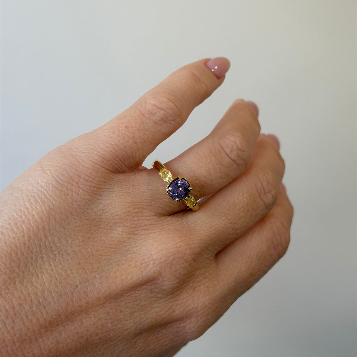 1.46CT VIOLET SPINEL & FANCY YELLOW DIAMOND TRILOGY RING